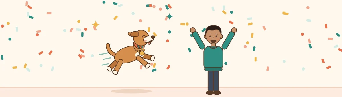 El perro salta de alegría con una medalla de huella, junto a su humano y rodeado de confeti